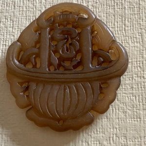 ..carved semi precious stone pendant